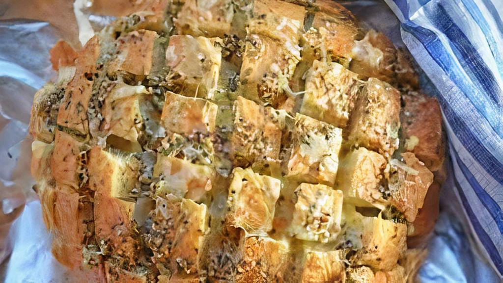 Garlic Bread With Cheese · A cross between garlic bread and pizza, cheesy bread is a quick, easy, and delicious party snack.