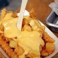 French Fries With Cheese · Melted cheese over our delicious fries.