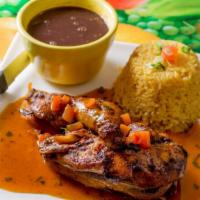 Arroz Con Pollo Plato · Half roasted chicken with rice and beans.