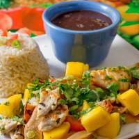 #26 Chicken Plato · Sautéed onions, peppers, and mango. Served with rice and beans.