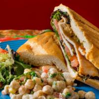 Grilled Chicken Cutlet Sandwich · With lettuce, tomatoes, and chipotle mayonnaise sandwich. Served with salad and chickpeas.