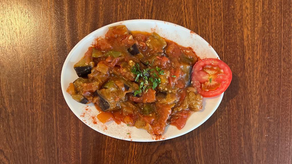 Sauced Eggplant · Fried eggplant, tomatoes, green peppers and garlic in our special tomato sauce.