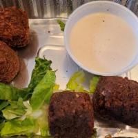 Falafel · Deeply fried chickpeas, vegetables, sesame blended with middle eastern spices.Tahini sauce a...