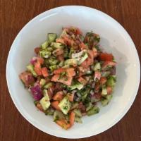 Shepherd Salad · Chopped cucumbers, tomatoes, red onion, and parsley tossed with extra virgin olive oil and l...