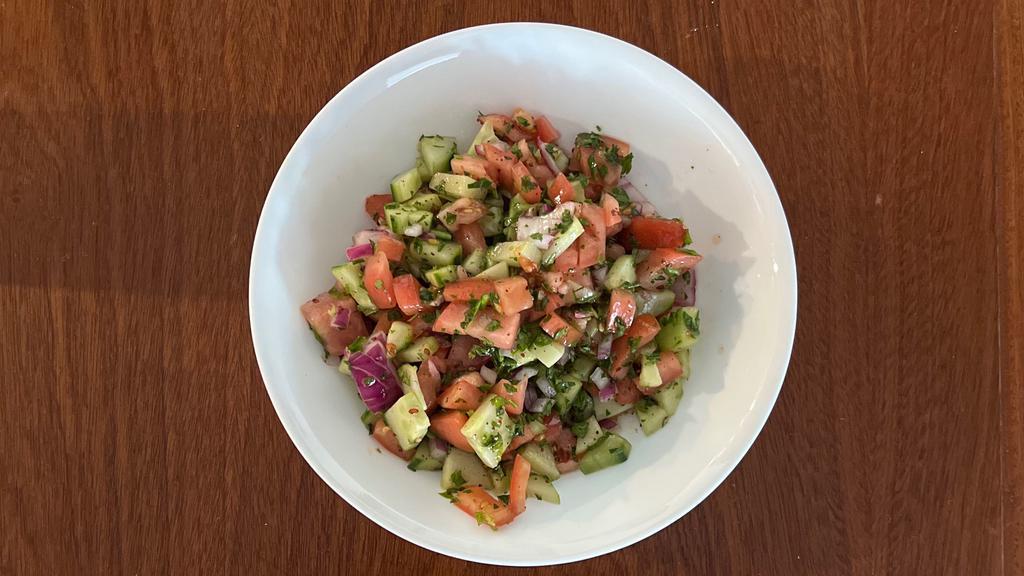 Shepherd Salad · Chopped cucumbers, tomatoes, red onion, and parsley tossed with extra virgin olive oil and lemon.