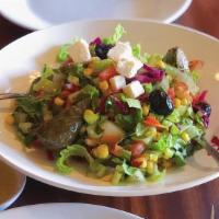 Akdeniz (Mediterranean Salad) · Fresh lettuce, shredded carrots, red cabbage, topped with Feta cheese, cucumbers and tomatoe...