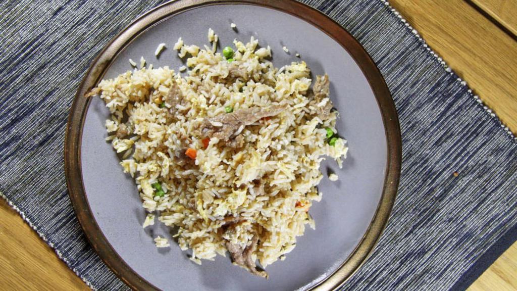 Fried Rice · Steaming white rice cooked to just the right consistency, filled with vegetable and your choice of beef, chicken, shrimp vegetable.