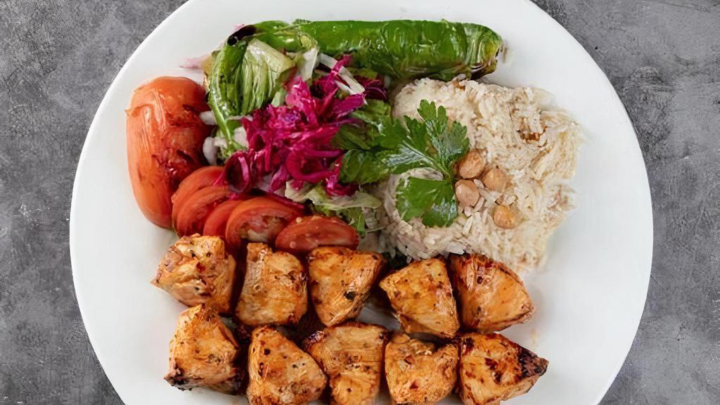 Chicken Shish Kebab Platter · Grilled marinated chicken thighs,hummus, tettuce,tomatoes,red cabbage and rice.