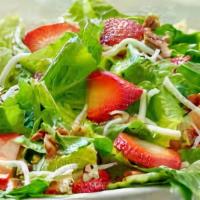Strawberry Moscato Salad · Romaine lettuce, tomato, cucumber and cheese topped with strawberries.