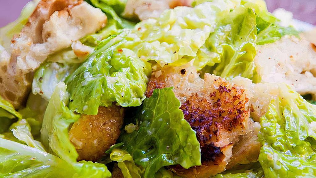 Caesar Salad · Romaine lettuce, grated parmesan cheese and croutons tossed in Caesar dressing.