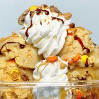 Peanut Butter Cookie Dough Sundae · 2 scoops of Vanilla ice cream, 2 scoops of our edible reeses pieces peanut butter cookie dou...