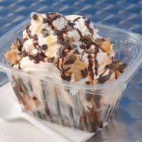 Brownie Sundae · Brownie topped with Vanilla ice cream caramel,  fudge, chocolate chips, cookie dough pieces ...