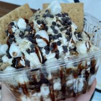 Some S'Mores Sundae · 3 scoops of Vanilla Fudge Ice Cream topped with chocolate syrup, marshmallow sauce, chocolat...