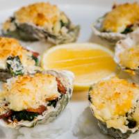 Rockin' Oyster Rockefeller (6Pcs) · Baked with monterey jack, mozzarella, spinach, garlic butter and parmesan crust.