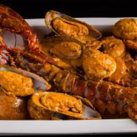 Whole Lobster Combo · One and a quarter pound of whole Maine lobster with (two) 1/2 lb. choice of Crawfish, Green ...
