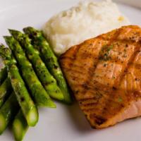 Grilled Salmon · Served with mashed potato, roasted seasonal vegetable, and garlic butter sauce.