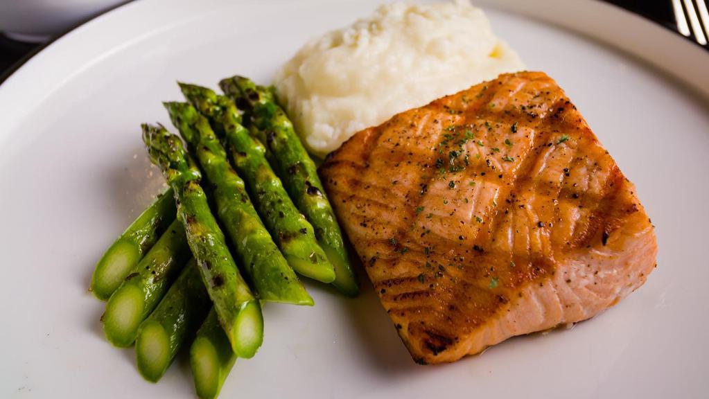 Grilled Salmon · Served with mashed potato, roasted seasonal vegetable, and garlic butter sauce.