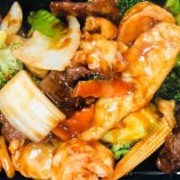 Triple Delight · Shrimp, chicken, beef with mixed vegetables.