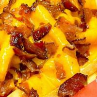 Bacon Cheese Fries · Traditional fresh cut french fries covered in melted cheese and crispy bacon.