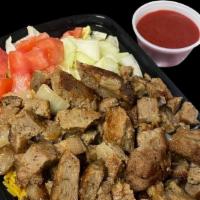 Lamb Over Rice · Rice platter with lamb lettuce diced cucumber diced tomato and your choice of sauce.