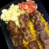 Kebab Over Rice · Rice platter with kebab lettuce diced cucumber diced tomato and your choice of sauce.