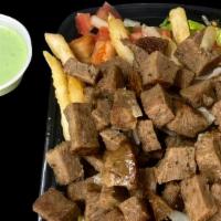 Lamb Over Fries · Fries platter with lamb lettuce diced cucumber diced tomato and your choice of sauce.