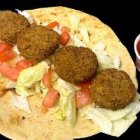 Falafel Gyro · Comes with falafel, lettuce, tomatoes, cucumbers, and the sauce of your choice.