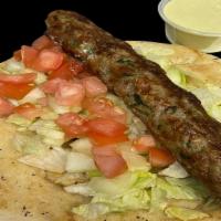 Kebab Roll · Comes with, seekh kebab, lettuce, tomatoes, cucumbers and the sauce of your choice.