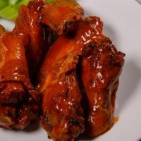 Chicken Wings (4 Pieces) ( Alitas De Pollo) · Four pieces of fried chicken wings with the sauce  of your election served with celery.