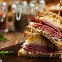 Pastrami Sandwich · Juicy sliced pastrami served with sliced tomatoes and lettuce.