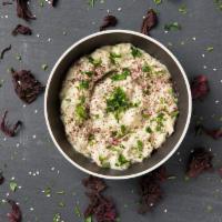 Baba-Ganoush · A Levantine dish of mashed roasted eggplant mixed with tahina, olive oil, and various season...