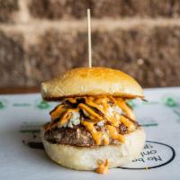 Montclair Blue Burger · Grass Fed Beef, topped with Blue Cheese, Sautéed Mushrooms and Chipotle Aioli served on a Co...