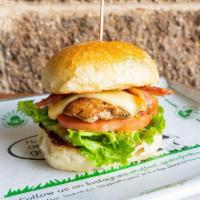 Turkey Club Burger · All Natural Turkey Burger topped with Smoked Gouda Cheese, Applewood Smoked Bacon, Lettuce, ...