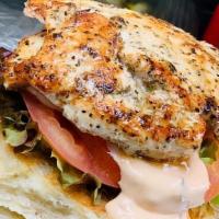Grilled Chicken Sandwich · All Natural Grilled Chicken, topped with Lettuce, Tomato, and Russian Dressing served on a C...