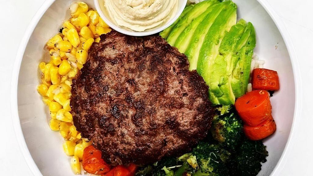 Burger Bowl W/ Hummus (Gf, V) · Grass Fed Beef Burger, topped with Grilled Broccoli, Grilled Carrots, Grilled Corn, Avocado, and Hummus served over your choice of Rice!