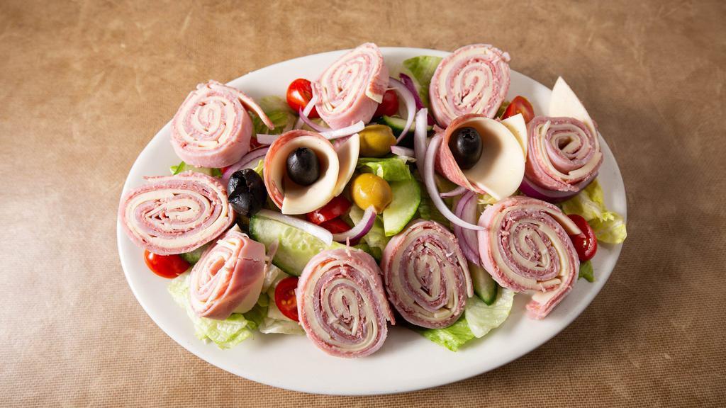 Chef Salad · Mixed greens with tomatoes, olives, red onions, cucumber topped with ham, salami and provolone.