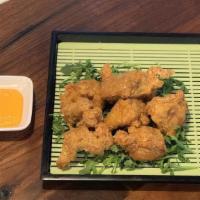 Chicken Karaage (A4) · Marinated chicken thigh deep-fried to a crisp perfection served with house dipping sauce.