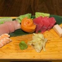 Sashimi Delux · 14 Pieces of assorted fresh raw fish, including Salmon (3), Tuna (3), Yellow Tail (3), White...