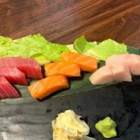 Sashimi Silver (8 Pcs) · Assorted fresh raw fish, including Salmon (3), Tuna (3) and Yellowtail (2)