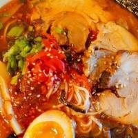 Red Volcano Ramen · Tonkotsu (pork) soup with shoyu (soy sauce) and house spicy paste topped with chashu (roast ...