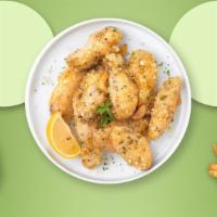 Garlic The Grate Wings · Fresh chicken wings breaded, fried until golden brown, and tossed in garlic and parmesan. Se...