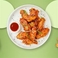Oriental Fusion Wings · Fresh chicken wings breaded, fried until golden brown, and tossed in sweet and sour sauce. S...