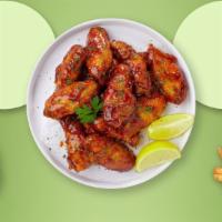 Sweet N' Smokin' Wings · Fresh chicken wings breaded, fried until golden brown, and tossed in honey and barbecue sauc...