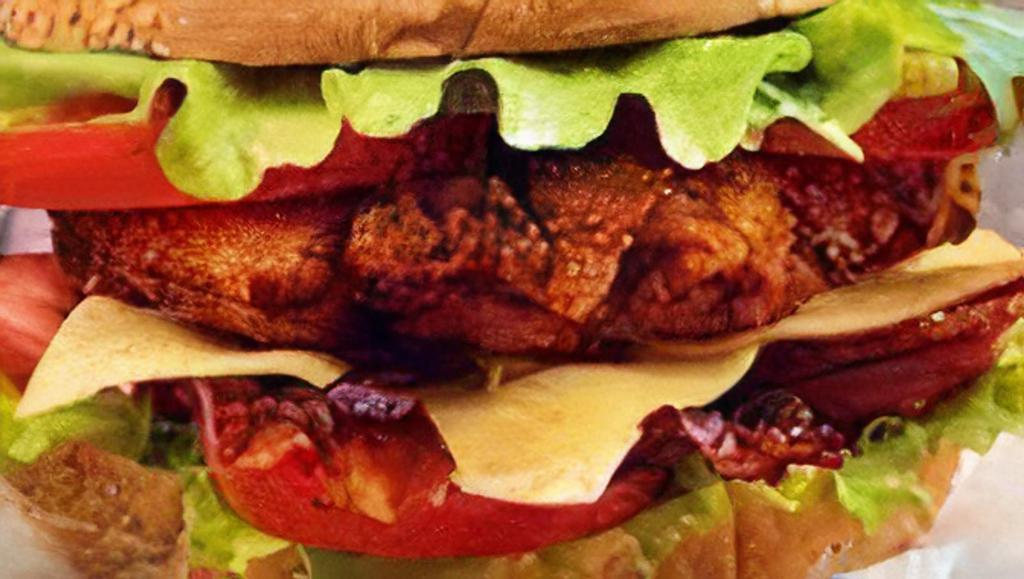 Cheddar Chicken Sandwich · 6 oz fried chicken breast, cheddar cheese, bacon, lettuce, tomato, special sauce on a brioche bun.