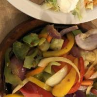 Vegetable Fajitas · Grilled vegetables with onions, tomatoes and bell peppers. Served with guacamole salad, sour...