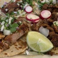 Taco A La Diabla · Four corn tortillas with steak and chorizo, cilantro and onions. Served with rice and beans,