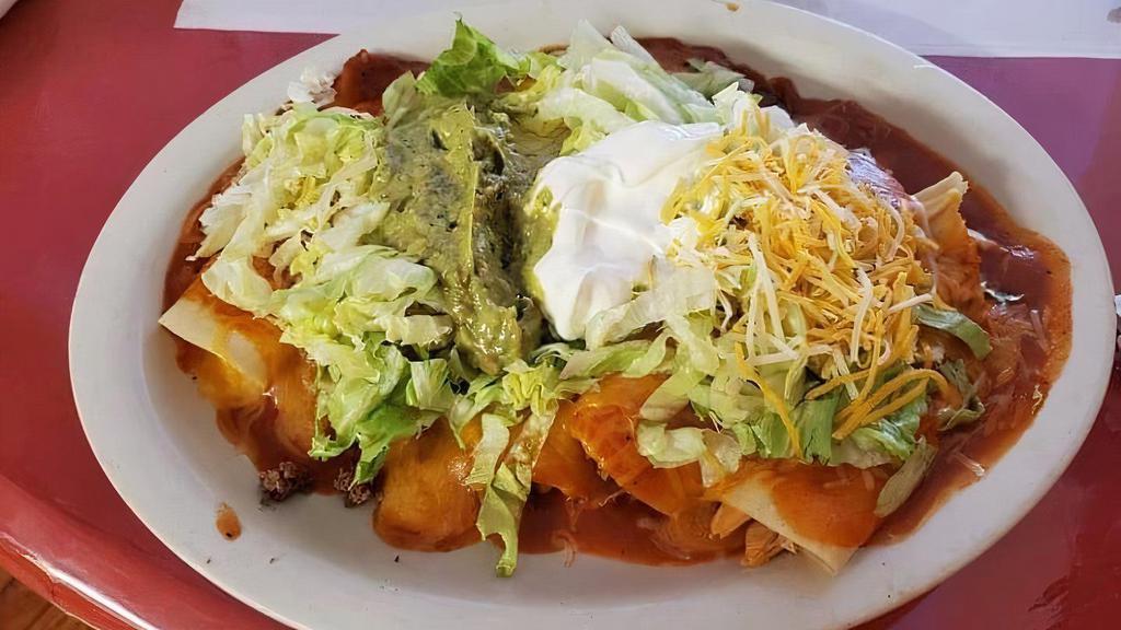 Enchiladas Super Ranchera · Five enchiladas, one shredded beef, one ground beef, one chicken, one being and one cheese. Topped with lettuce and guacamole.