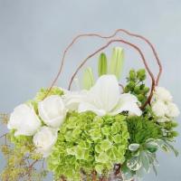 Chic & Styled · A naturally styled combination of lilies, roses and hydrangea in a clear vase accented with ...