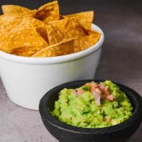 Guacamole & Fresh Chips Tapas · Fresh prepared guacamole with cilantro, lime, fresh tortilla chips, and pickled jalapeño.