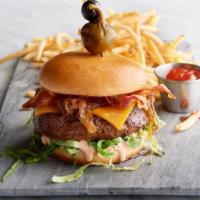 The Oceanaire Burger · Louie dressing, caramelized onion, lettuce, french fries.